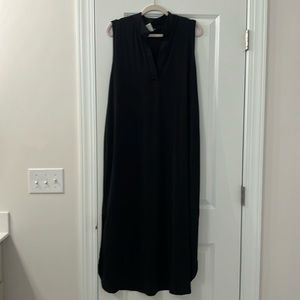 Maxi length black sleeveless dress.
